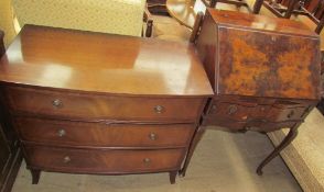 A 20th century mahogany chest with a "D" shaped top above three long drawers on a splayed feet