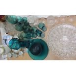 A green glass lemonade set together with decanters and glasses, glass bowls,