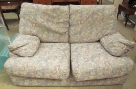 An upholstered two seater settee