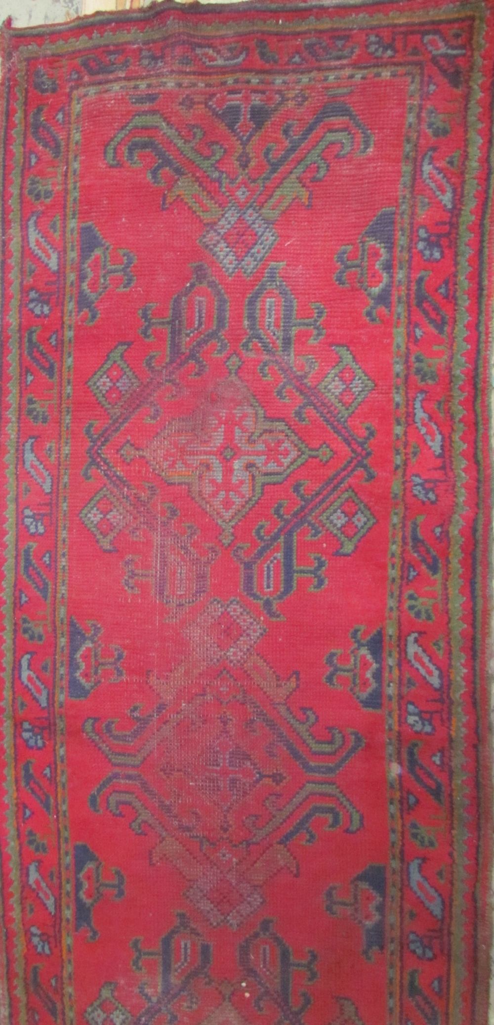 A red ground runner with a geometric design together with a prayer rug with central mihrab and a - Image 3 of 3