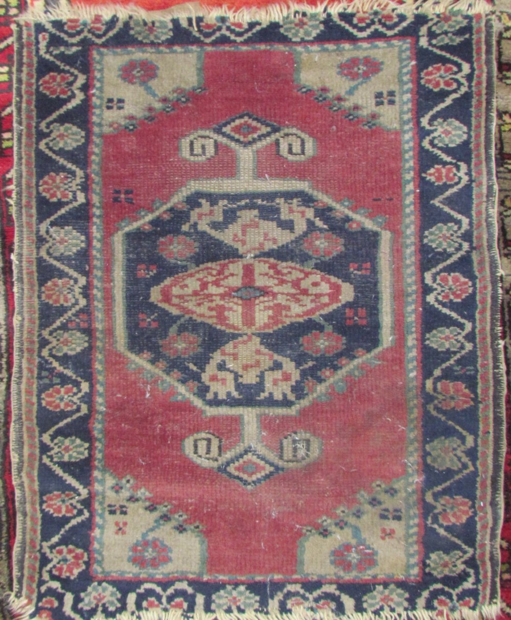 A red ground runner with a geometric design together with a prayer rug with central mihrab and a - Image 2 of 3