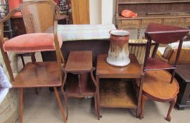 An Edwardian mahogany two tier table together with a two tier trolley, three occasional tables,