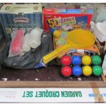 A collection of outdoor toys including a croquet set,