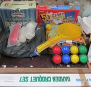 A collection of outdoor toys including a croquet set,