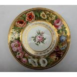 A Swansea porcelain plate painted to the edge with flowers and leaves in a gilt border,