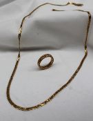 An 18ct yellow gold necklace, together with an 18ct yellow gold rope twist ring,