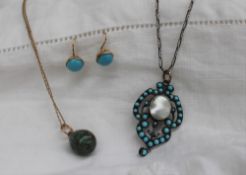 A turquoise and pearl set pendant,