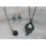 A turquoise and pearl set pendant,