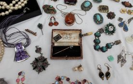 Assorted costume jewellery including faux pearls, other necklaces, brooches,