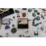 Assorted costume jewellery including faux pearls, other necklaces, brooches,