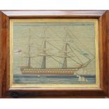 A Victorian Sailor's woolwork picture of a three masted ship with other boats in the foreground,