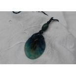 Almeric Walter - a pate de verre glass pendant moulded with a cricket in blues and greens on a