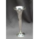 A white metal bud vase, the flared top above a tapering body on a spreading foot, marked Sterling,