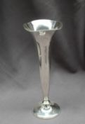 A white metal bud vase, the flared top above a tapering body on a spreading foot, marked Sterling,