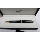 A Montblanc Meisterstuck ballpoint pen, in black, the presentation case printed FIFA,