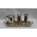 An Elizabeth II silver cruet set, comprising a tapering cylindrical salt, pepper and mustard pots,