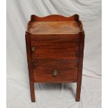 A George III mahogany night table, the galleried top with cut out handles above a single cupboard,