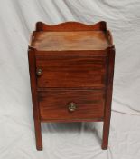 A George III mahogany night table, the galleried top with cut out handles above a single cupboard,