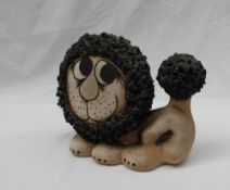 A John Hughes pottery lion, 13.