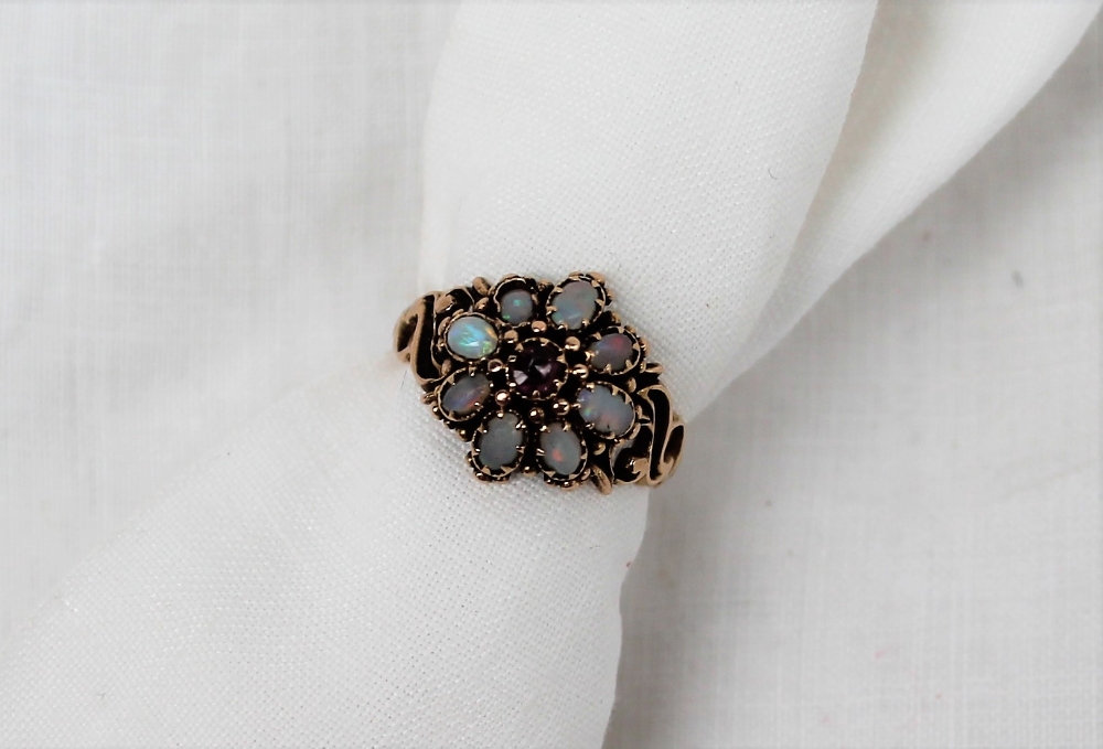 A 15ct yellow gold opal set dress ring,