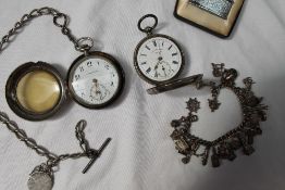 A white metal open faced pocket watch,
