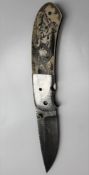 A Keith Coleman lock knife, with a Damascus blade, inscribed 'Keith Coleman Albuquerque, NM,