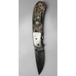 A Keith Coleman lock knife, with a Damascus blade, inscribed 'Keith Coleman Albuquerque, NM,