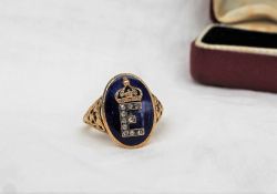 A 19th century diamond enamel and yellow metal ring with the letter "E" picked out in rose diamonds