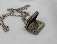 A George IV silver vinaigrette of rectangular form with a raised edge and initialled cartouche,