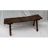An 18th century elm planked bench on four octagonal tapering legs, 30.