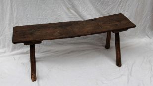 An 18th century elm planked bench on four octagonal tapering legs, 30.