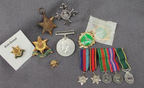 A set of five World War II minature medals together with The War Medal, The Burma Star, OBE,