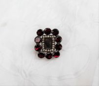 A Garnet and seed pearl set mourning brooch,