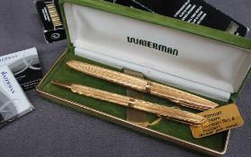 A Waterman C/F Plaque OR G gold plated fountain pen together with a matching ballpoint pen,