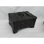 A Polish carved coal jewellery box, the top carved with a miner underground,