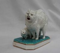 A Continental porcelain table top match dispenser modelled a cat and kitten,