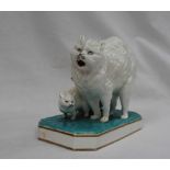 A Continental porcelain table top match dispenser modelled a cat and kitten,