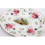 A 19th century English porcelain oval dish, painted to the centre with a wading bird,