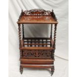 A Victorian rosewood Canterbury / whatnot, with a pierced three quarter gallery,