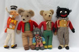 Two Gollywog teddy bears, together with Gollywog badges, Sunny Jim doll,