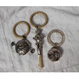 A George V silver baby's rattle in the form of a teddy bear with a teething ring and mother of