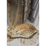 A silk fan, embroidered with flowers and leaves to bone guard sticks,