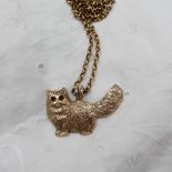 A 9ct yellow gold pendant in the form of a Persian cat, on a 9ct yellow gold chain,