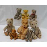 Eight miniature teddy bears,