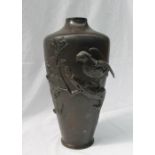A Japanese bronze vase of tapering cylindrical form cast with an eagle on a branch,
