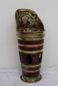 A coopered and brass umbrella stand, the raised back embossed with grapes and leaves,