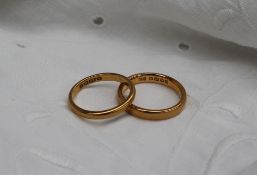 Two 22ct yellow gold wedding bands, approximately 9 grams,