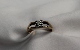 A solitaire diamond ring the round old cut stone approximately 0.