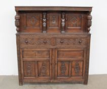 A 17th century style oak court cupboard,