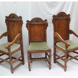 A set of eight 17th century style yew dining chairs,